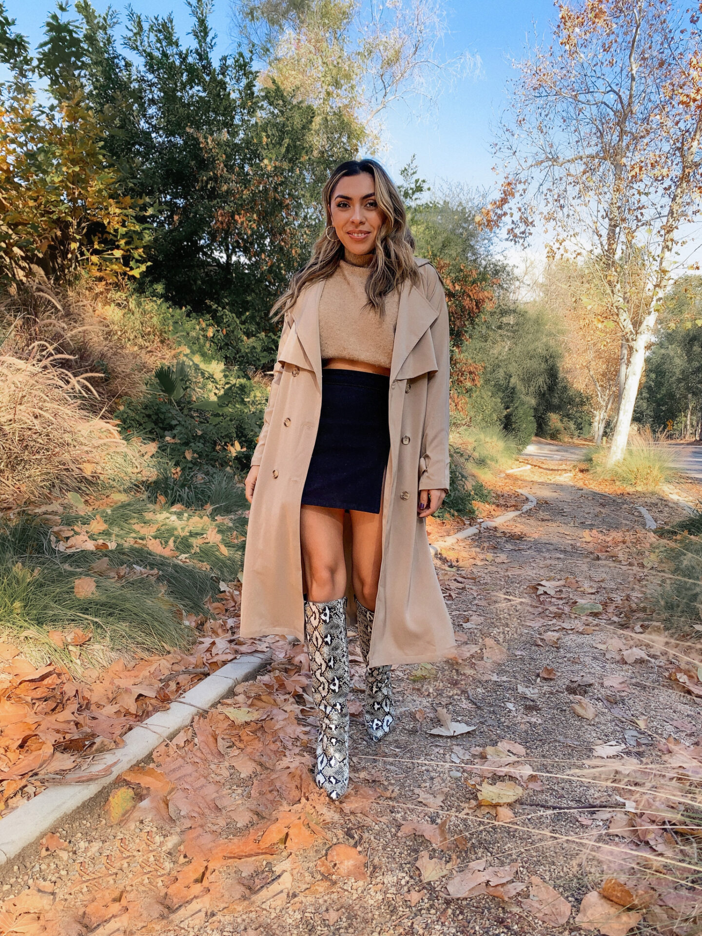 Alexis Alcala showing how you can wear a trench coat in 4 different ways. 