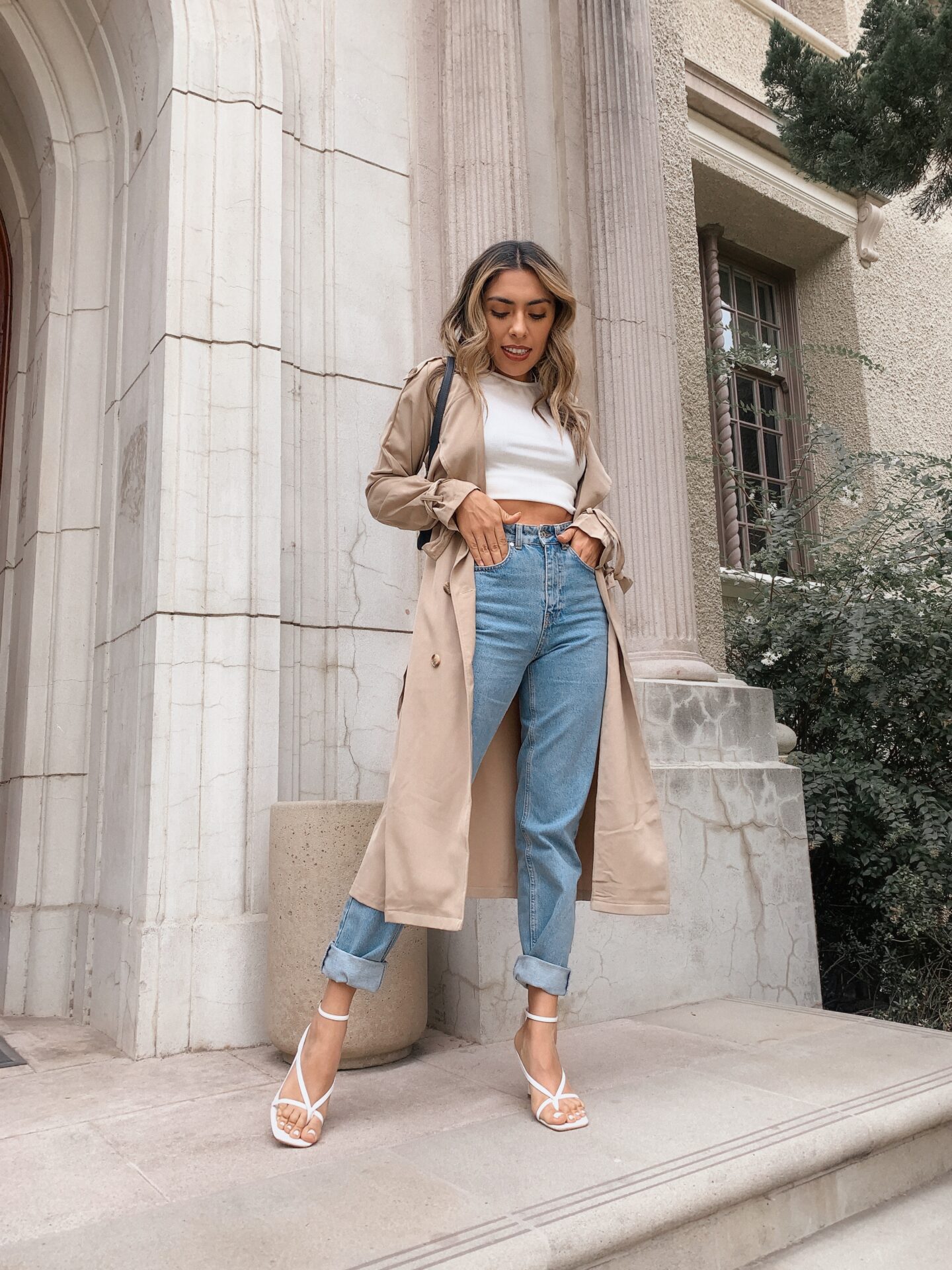 Alexis Alcala showing how you can wear a trench coat a classic peice in 4 different ways.