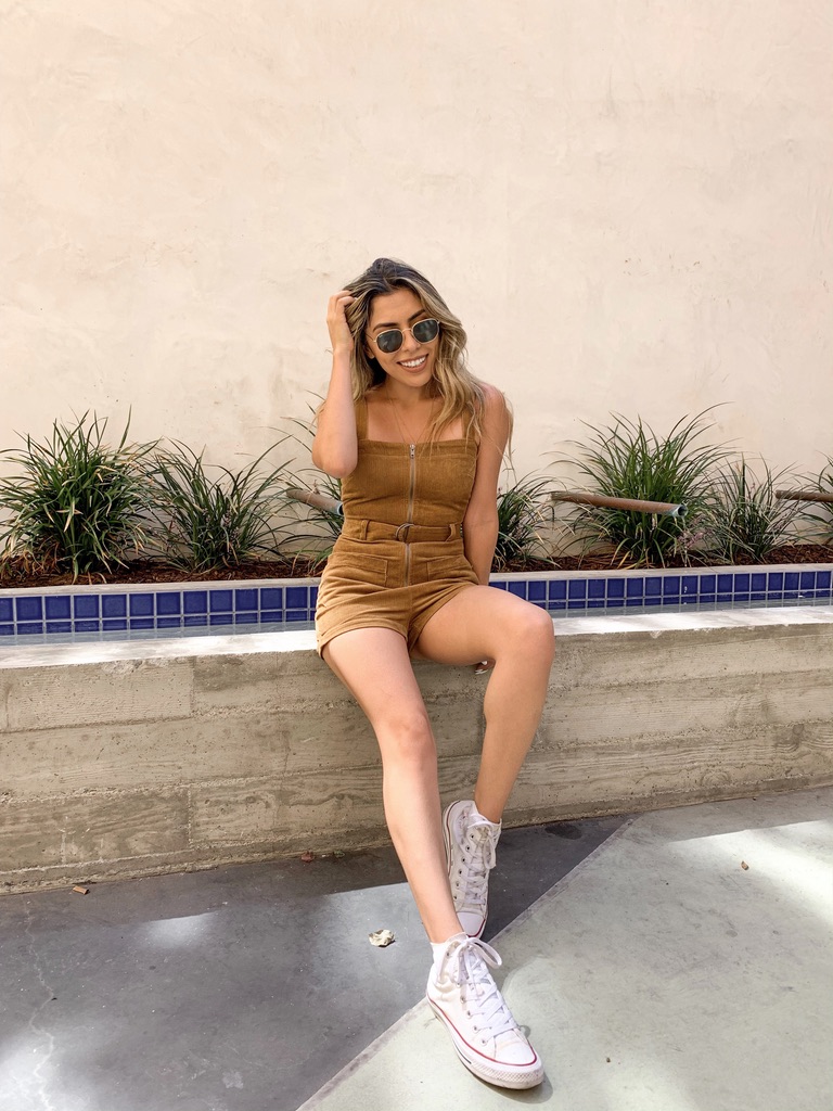 Alexis Alcala wearing a corduroy romper from summer to fall 